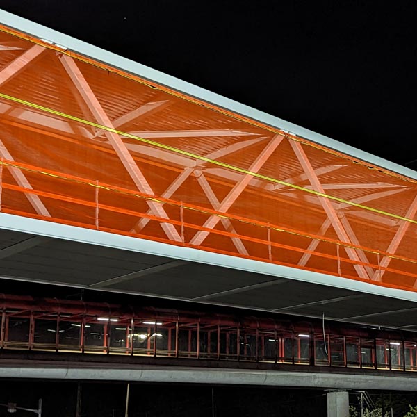 TallRail.com TallRail provides floor-to-ceiling coverage debris control for large openings.